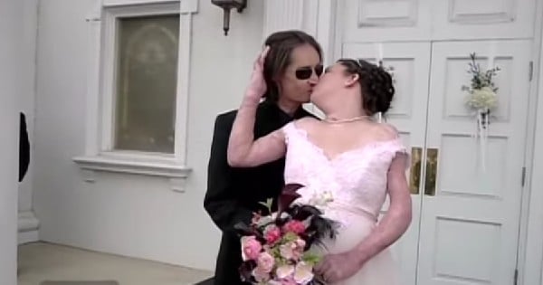 couple kissing outside a church at their wedding