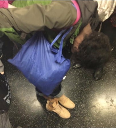 mj-godupdates-girl-gives-shoes-to-homeless-woman-on-subway-2