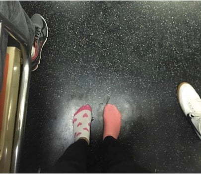 mj-godupdates-girl-gives-shoes-to-homeless-woman-on-subway-3