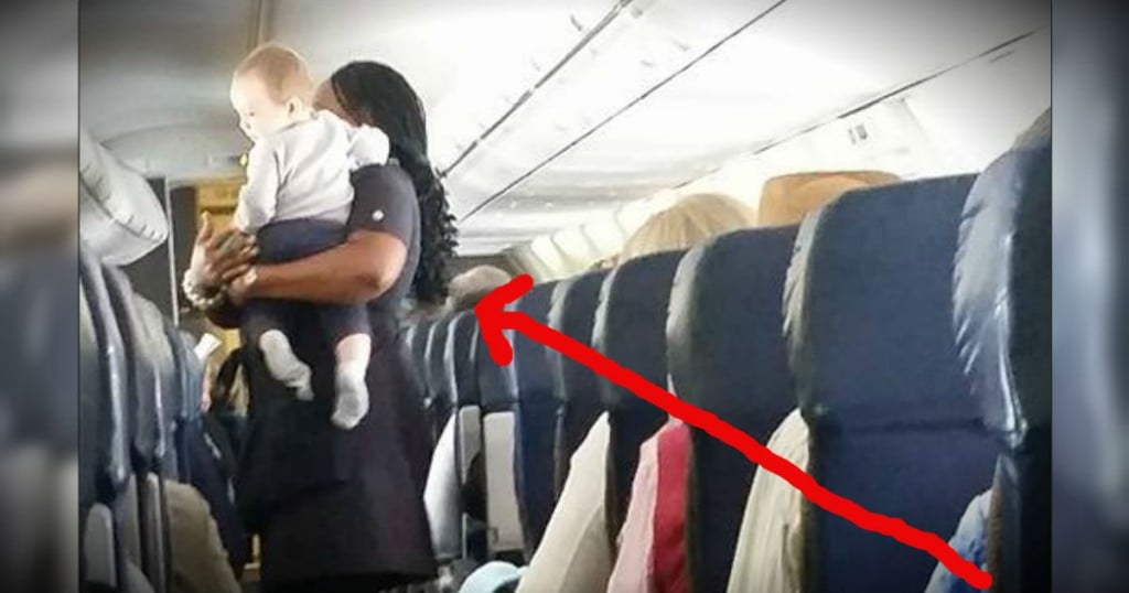 mj-godupdates-flight-attendant-keeps-baby-happy-fb