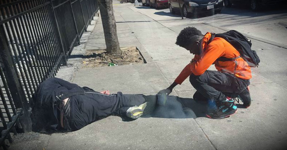 godupdates officer sees teen pray over homeless man fb
