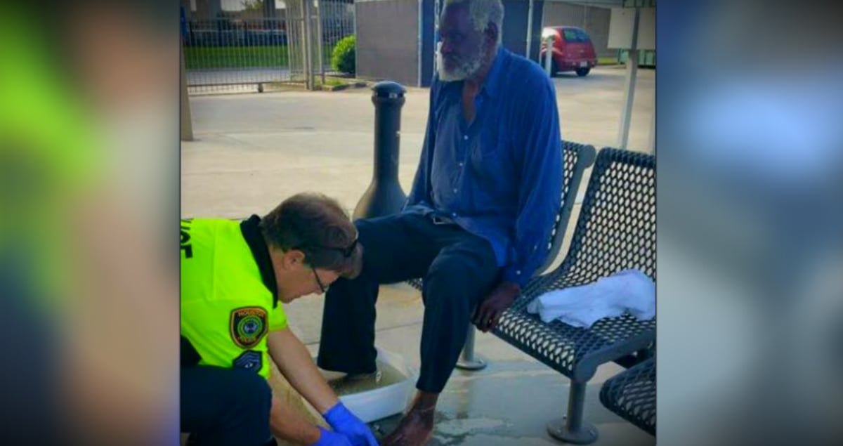 godupdates police officer washeing blind homeless man's feet fb