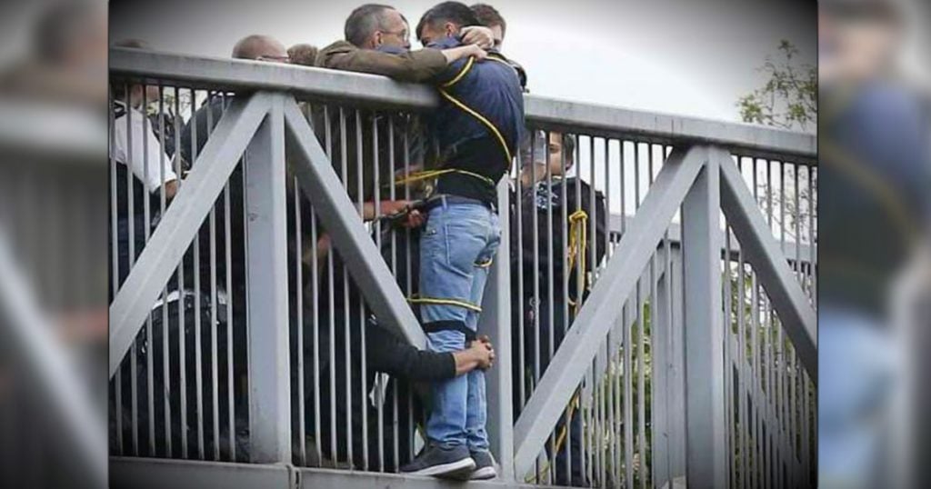 godupdates group of strangers hold suicidal man on bridge fb