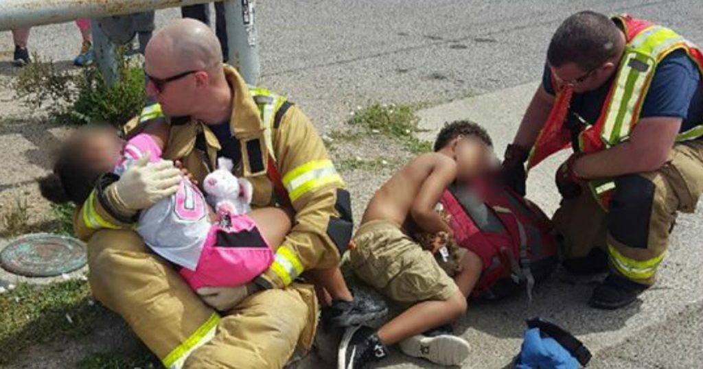 godupdates firefighters comfort scared children after car crash fb