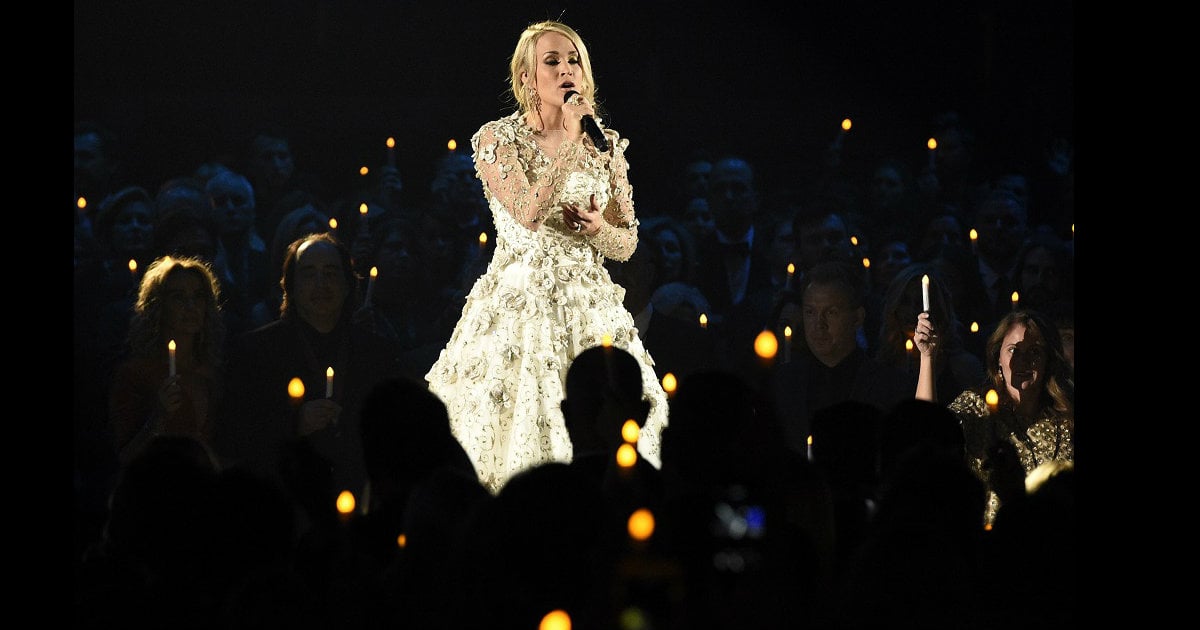 godupdates carrie underwood sings for victims