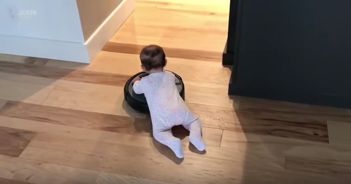 Baby Hilariously Hitches A Ride On A Roomba Vacuum