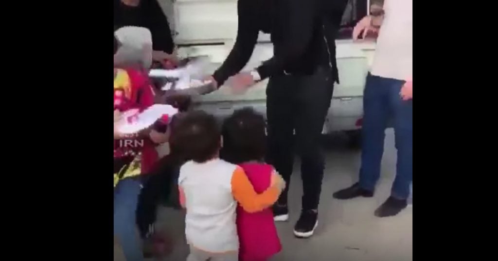 Boy Helps Girl Get Food After Earthquake