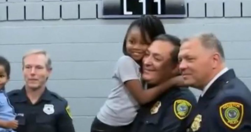 godupdates little girl hugs police officers