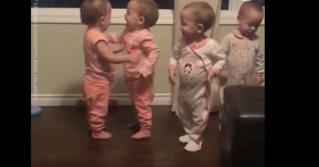 godupdates adorable quadruplets sharing goodnight hugs