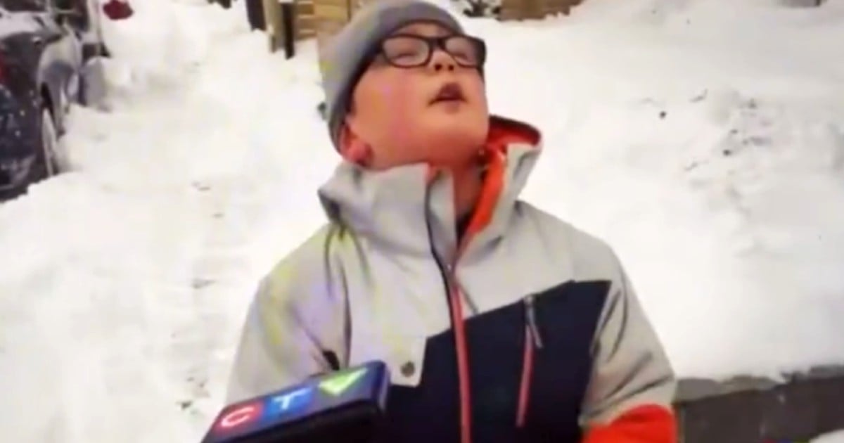 boy shoveling snow exhausted