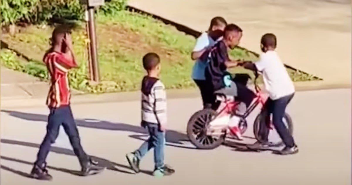 the neighborhood kids ride his bike