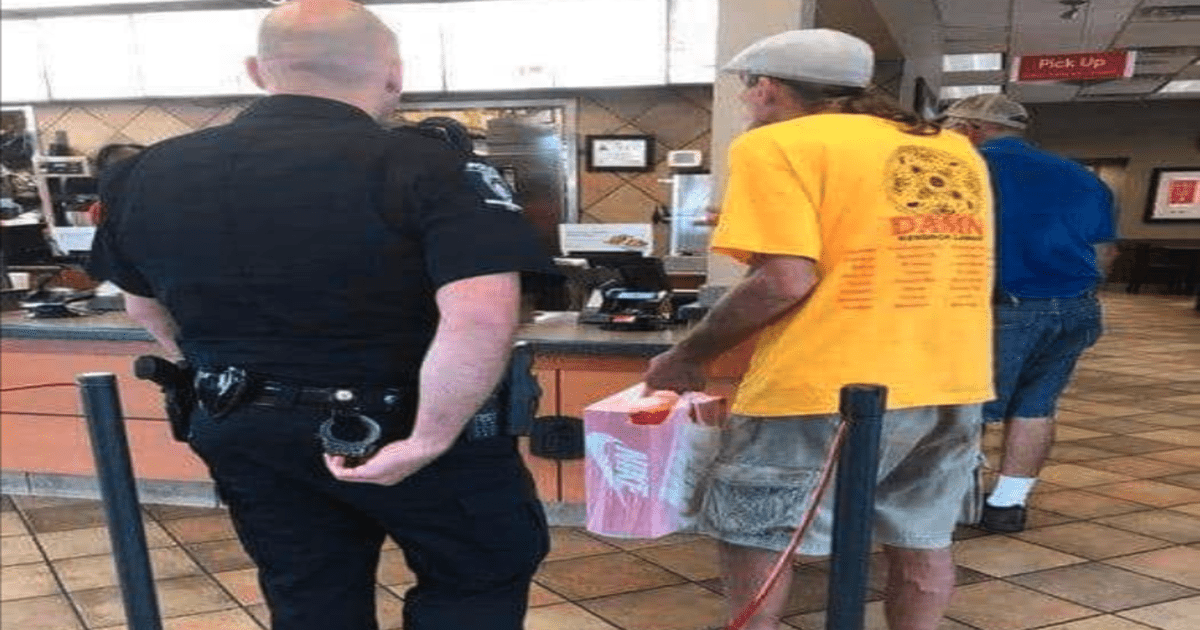 officer with man in chick-fil-a