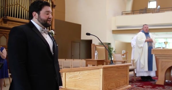 groom sings to bride at wedding the lord's prayer
